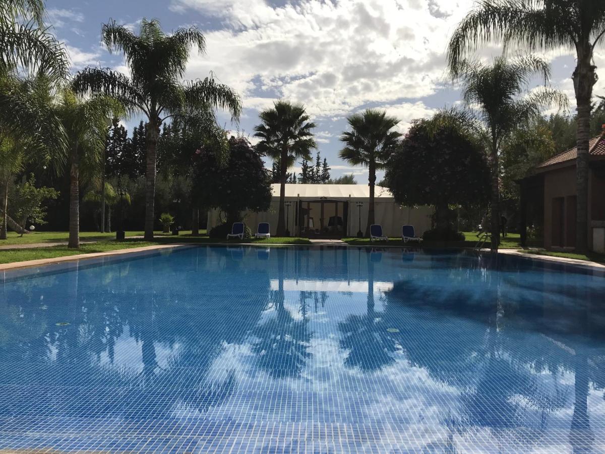 El Olivar Palace Marrakech El Harkat Εξωτερικό φωτογραφία The swimming pool at the hotel
